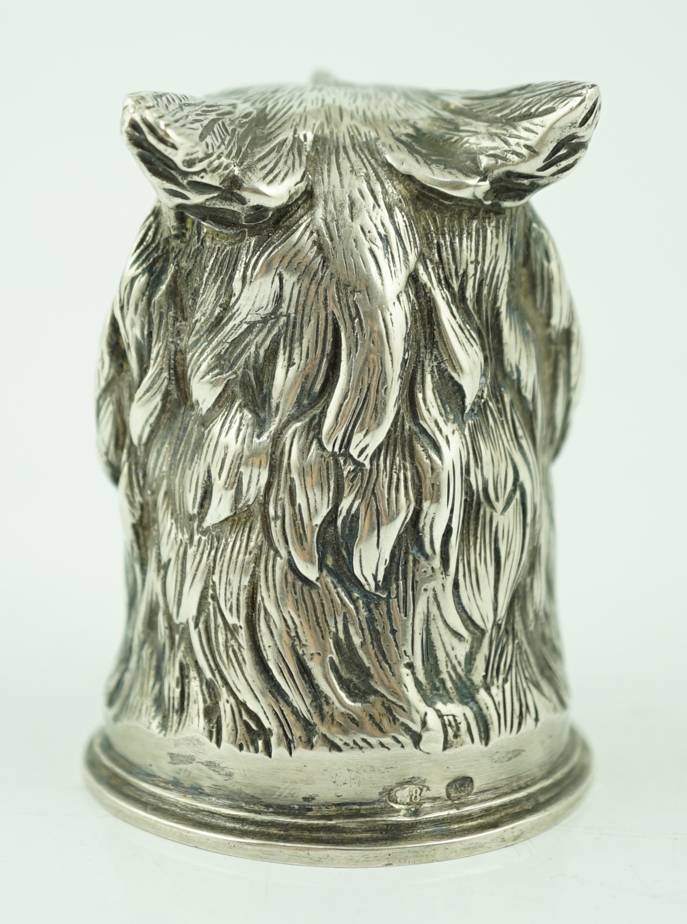 An early 20th century Russian 84 zolotnik 'stirrup' cup, modelled as the head of an owl, maker H.W.